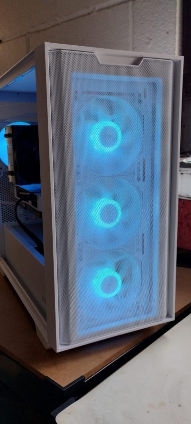 White computer case with three blue LED fans and visible internal components.