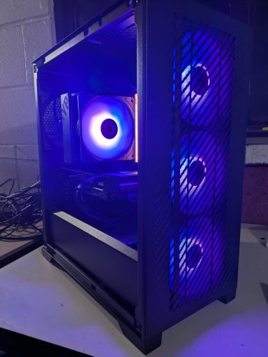 A computer case featuring three blue LED fans and a glowing interior.