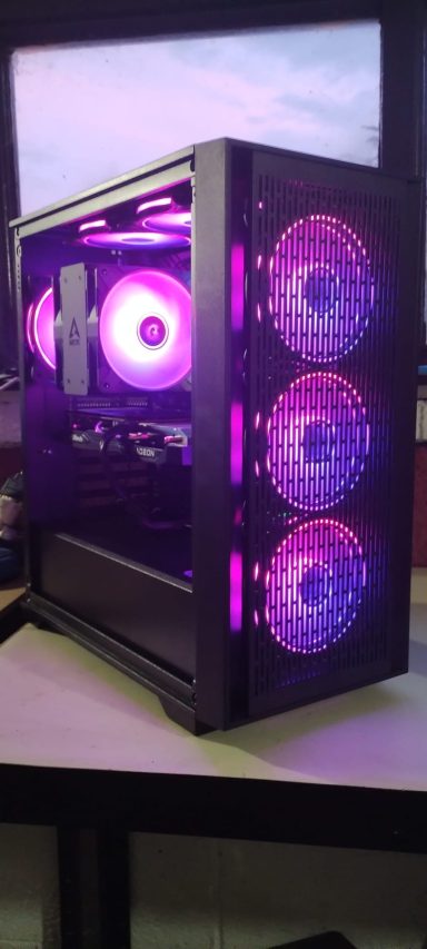 A stylish black gaming PC case with purple LED lights and three visible fans.