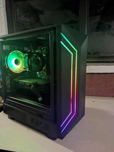 A modern gaming PC case with RGB lighting and a transparent side panel.