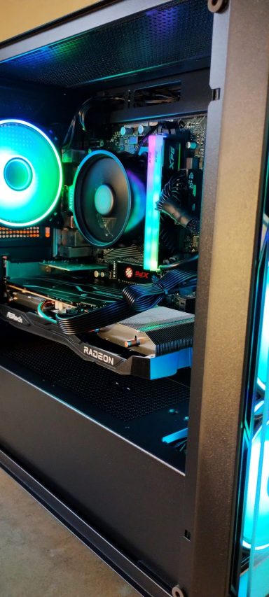 Black computer case with RGB lighting and visible internal components.
